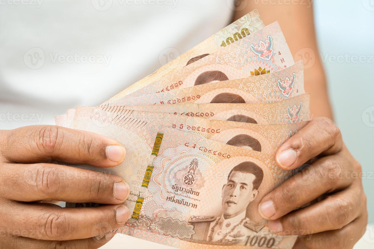 Asian woman holding Thai banknotes money, economy finance exchange trade investment. photo