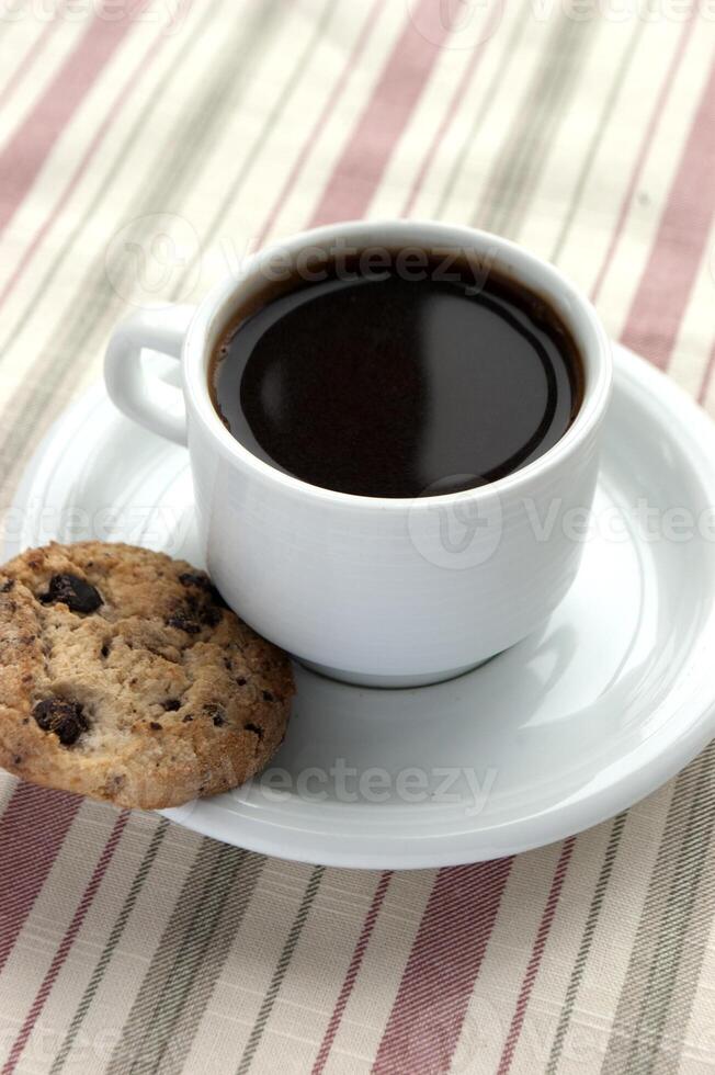 Breakfast beverage as a cup of fresh coffee with butter cookies photo