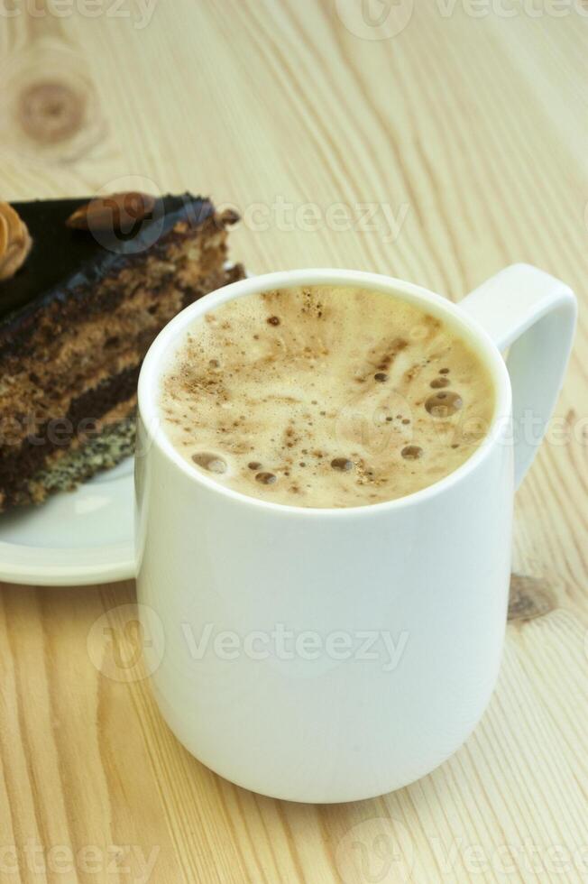 cappuccino and cake on the table photo