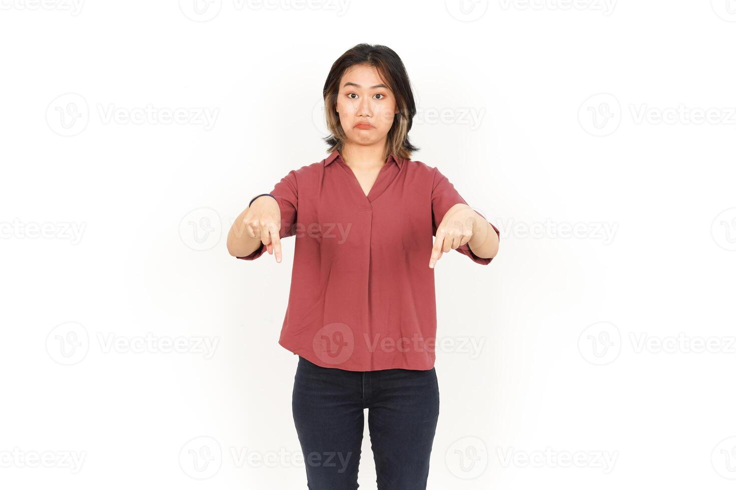 Showing Product and Pointing Down Of Beautiful Asian Woman Isolated On White Background photo
