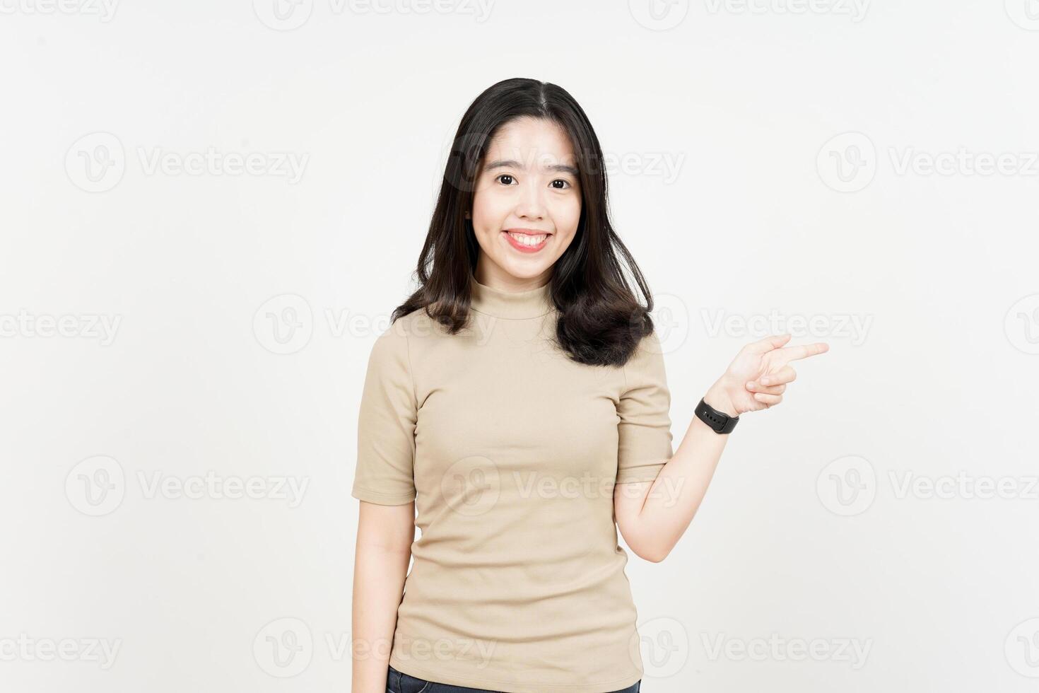 Showing Product and Pointing Side Of Beautiful Asian Woman Isolated On White Background photo