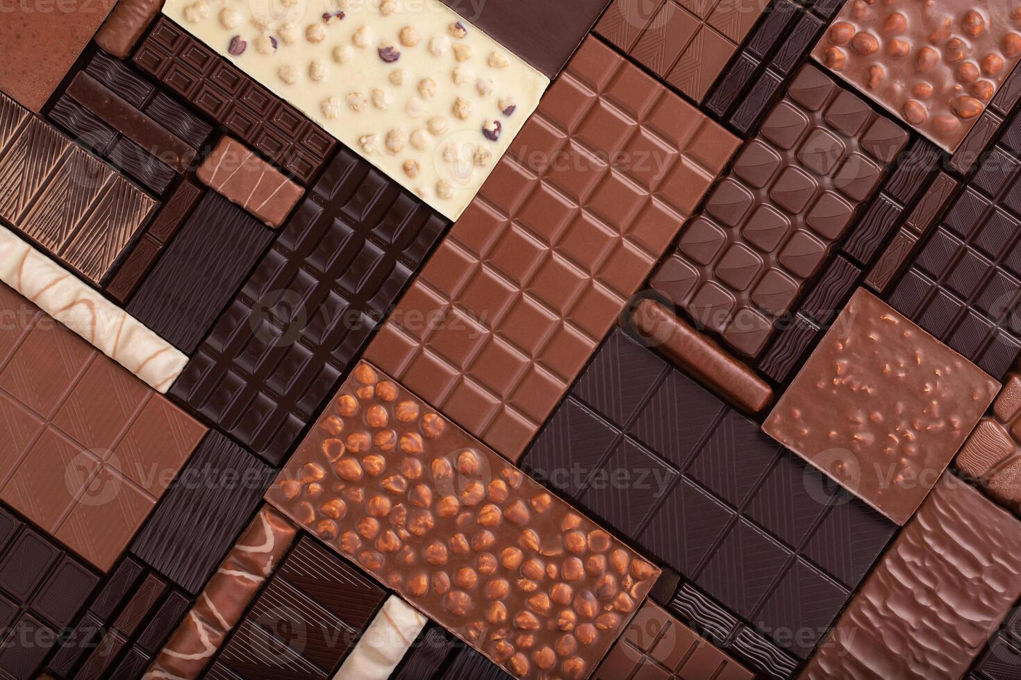 varied chocolate background. milk and dark cocoa bar, top view. photo