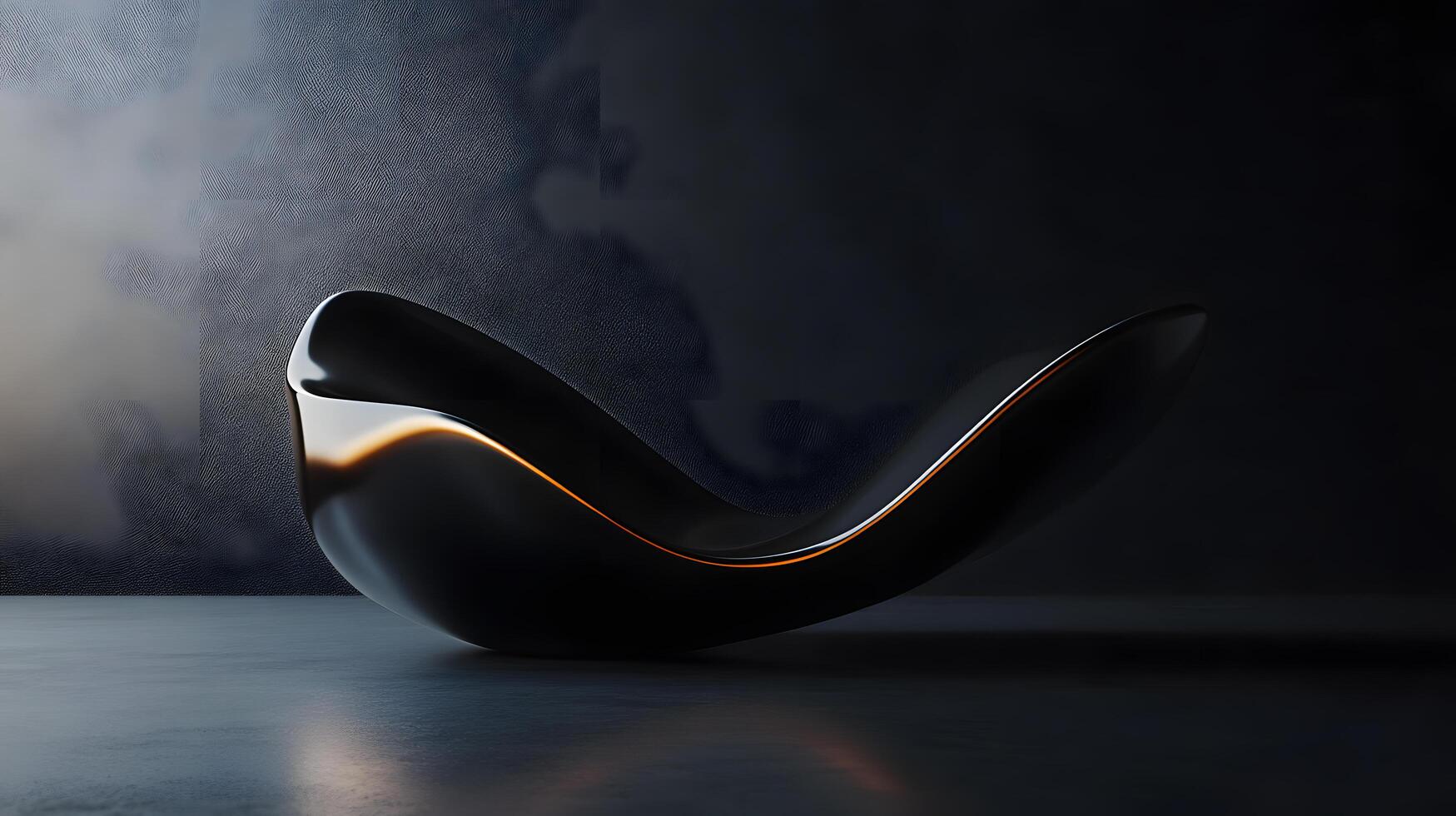 A black and silver object with a curved shape photo