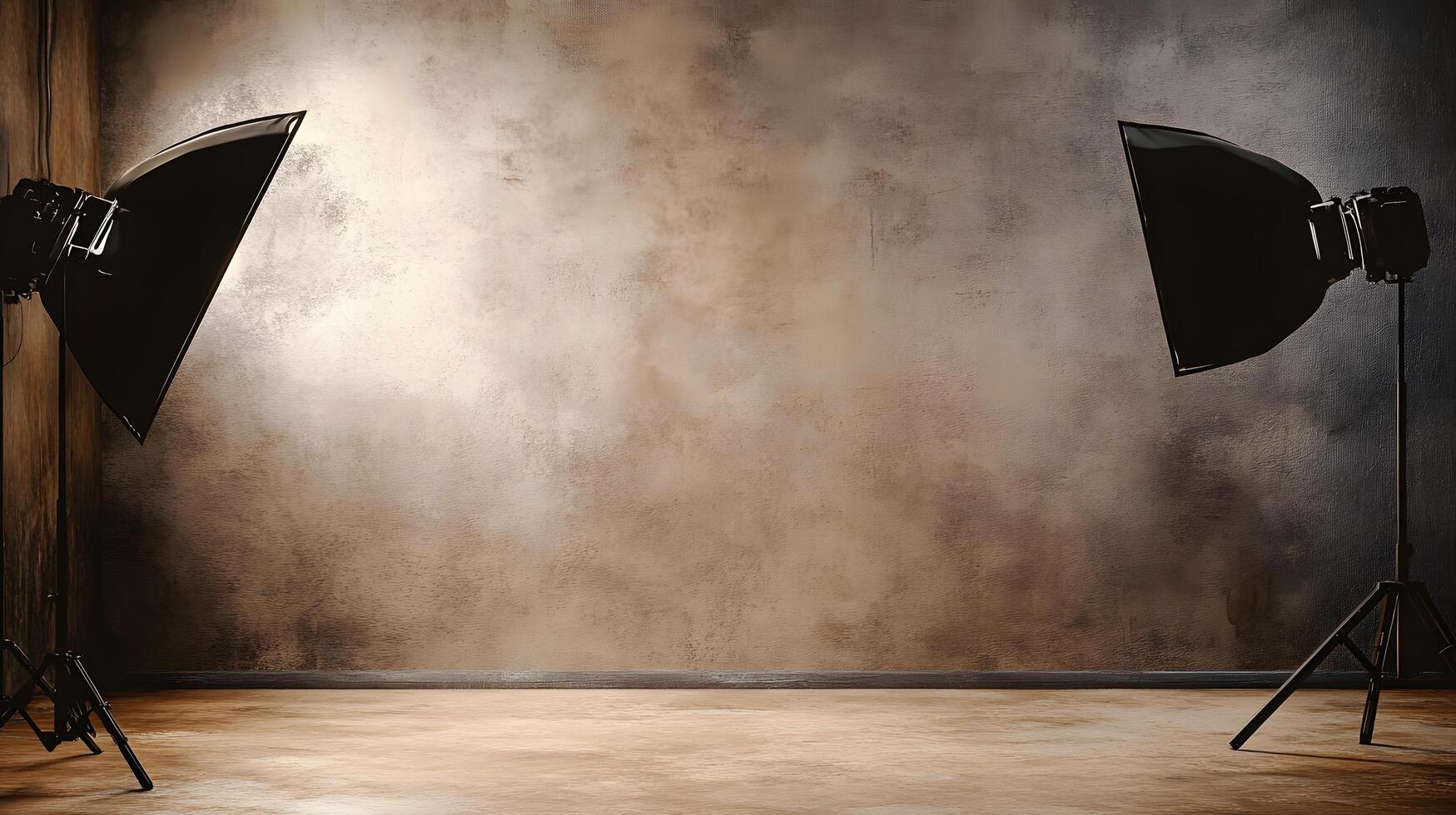 Two black lighting equipment are placed in front of a wall photo