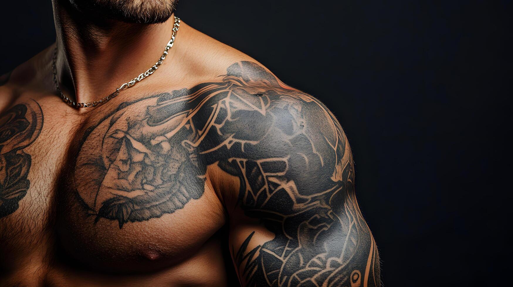 A man with tattoos on his arm and chest photo