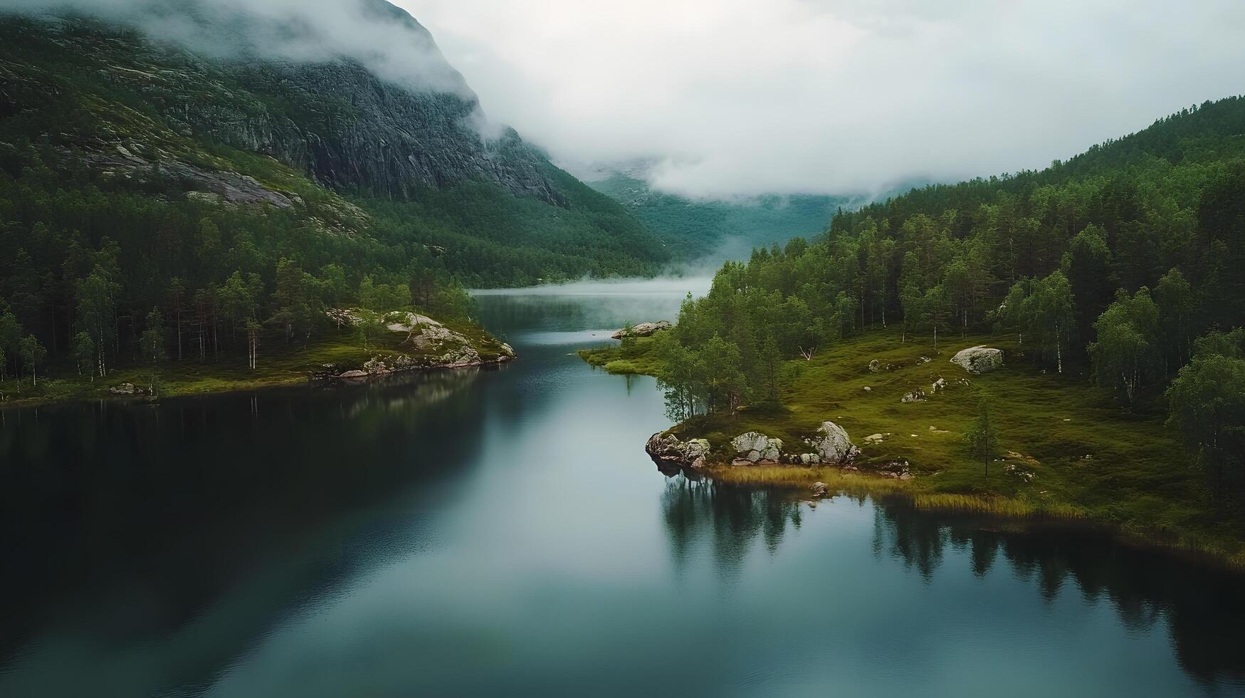 A beautiful lake surrounded by trees and mountains photo