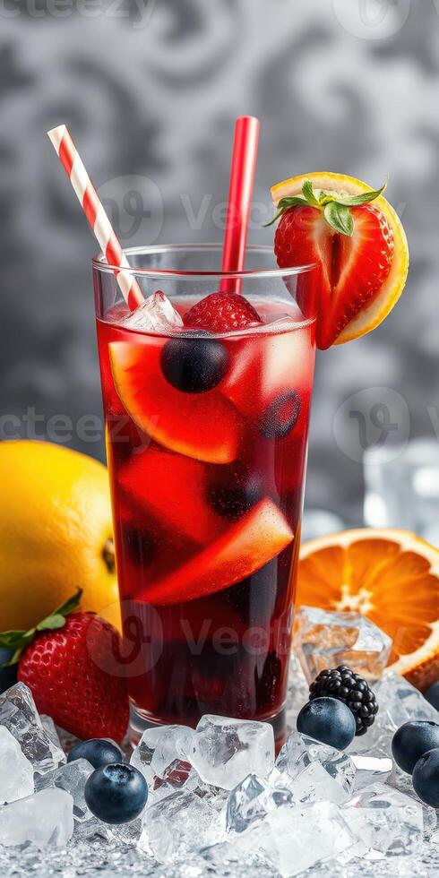 Refreshing fruit punch served in a tall glass with vibrant berries and citrus slices on a chilled surface photo