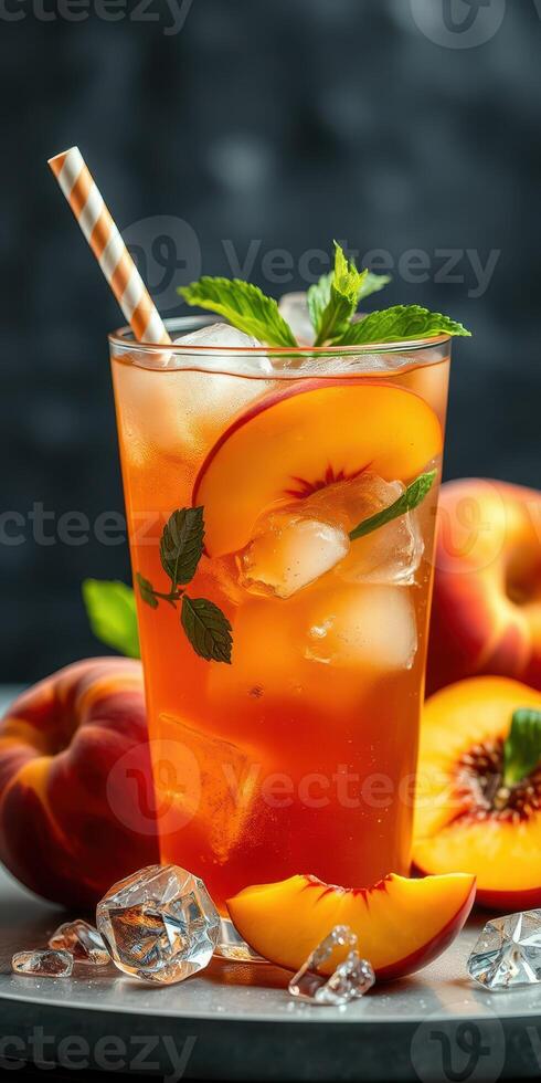 Refreshing peach tea with fresh mint leaves and ripe peaches garnished with ice photo