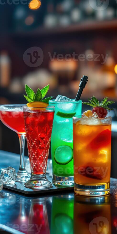 Colorful cocktails served on a bar counter with garnishes and ice during a vibrant evening setting photo