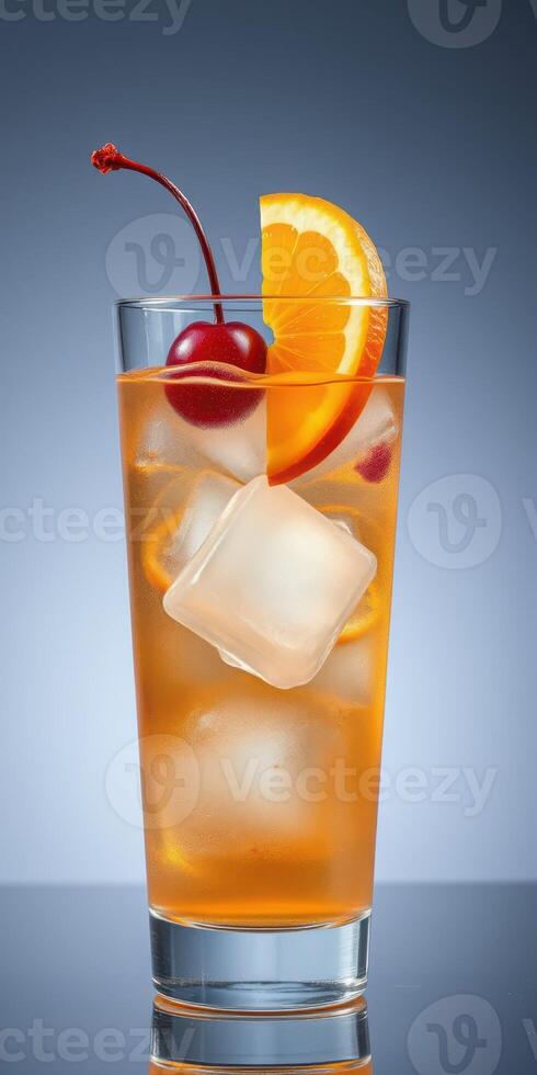 Refreshing cocktail garnished with cherry and orange slice served in a glass with ice cubes photo