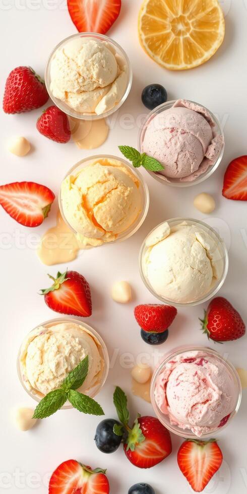 Colorful assortment of ice cream scoops with fresh fruit on a white background during a summer celebration photo