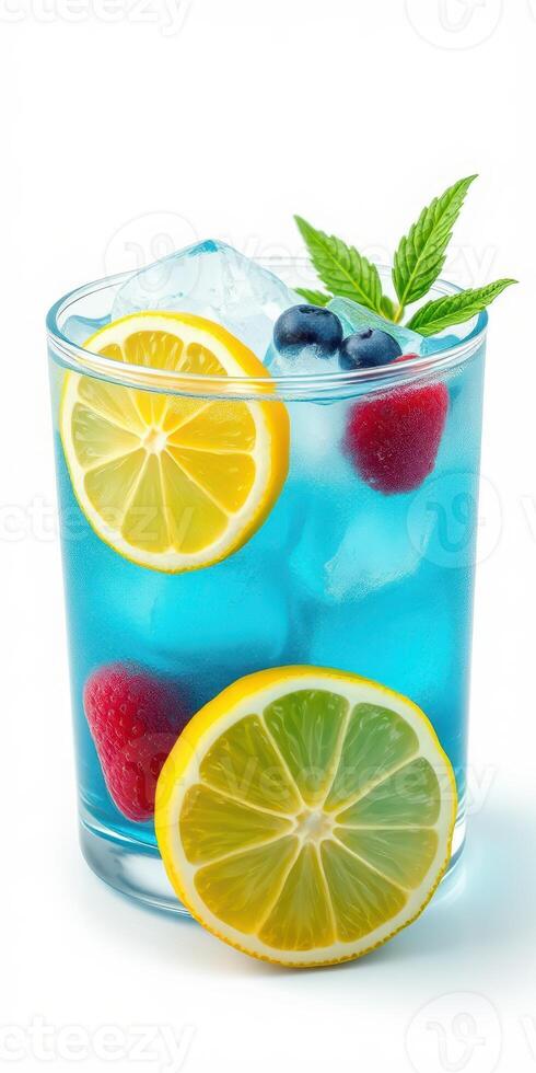 Refreshing blue lemonade with fresh fruit garnishes served in a clear glass on a bright background photo
