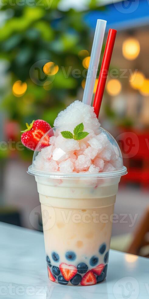 Delicious dessert drink with crushed ice, tapioca pearls, and fresh strawberries in a vibrant cafe setting photo