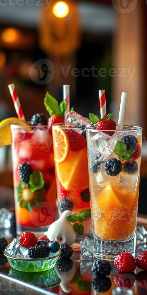 Refreshing fruit cocktails with vibrant colors served in tall glasses at a lively bar setting photo