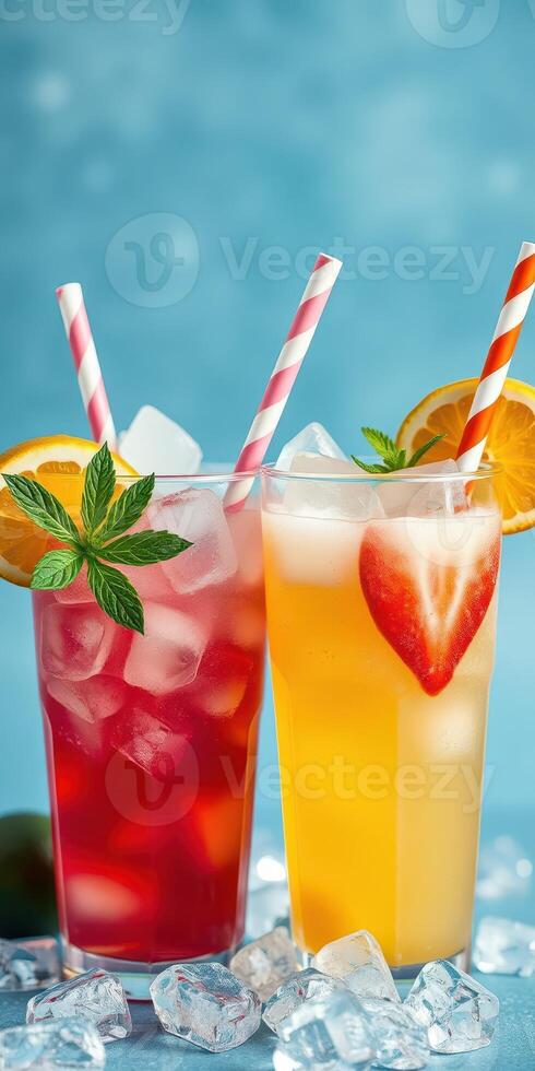 Refreshing summer cocktails with colorful fruits and ice garnished with mint and striped straws in a bright setting photo