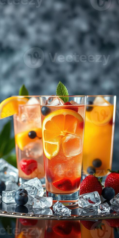 Refreshing summer cocktails with vibrant fruits and ice at a sunny outdoor gathering photo