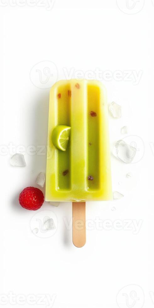 Refreshing tropical popsicle with lime and raspberry placed on ice cubes in sunny weather photo