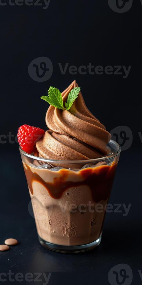 Delicious chocolate soft serve topped with fresh strawberries and mint on a dark background photo