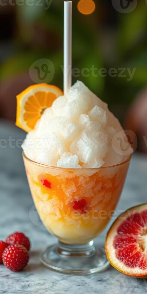 Delicious frozen dessert topped with fluffy ice shavings, served with fruit garnishes and vibrant colors photo