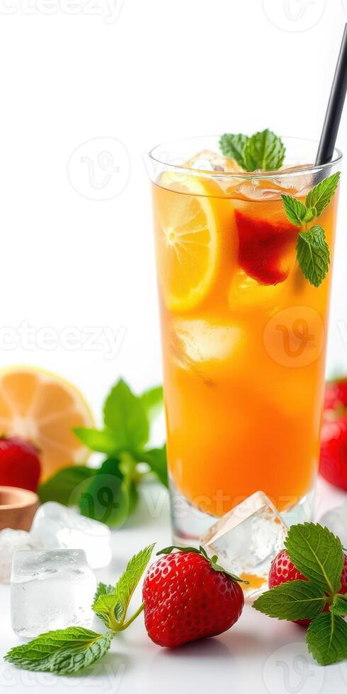 Refreshing fruit drink garnished with mint and strawberries served with ice and citrus slices in a bright setting photo