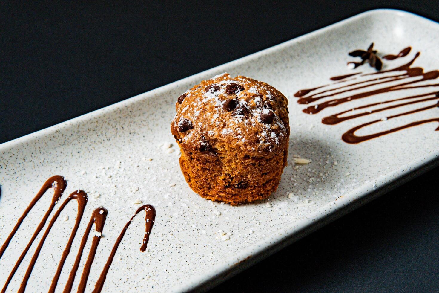 Muffin with powdered sugar. photo
