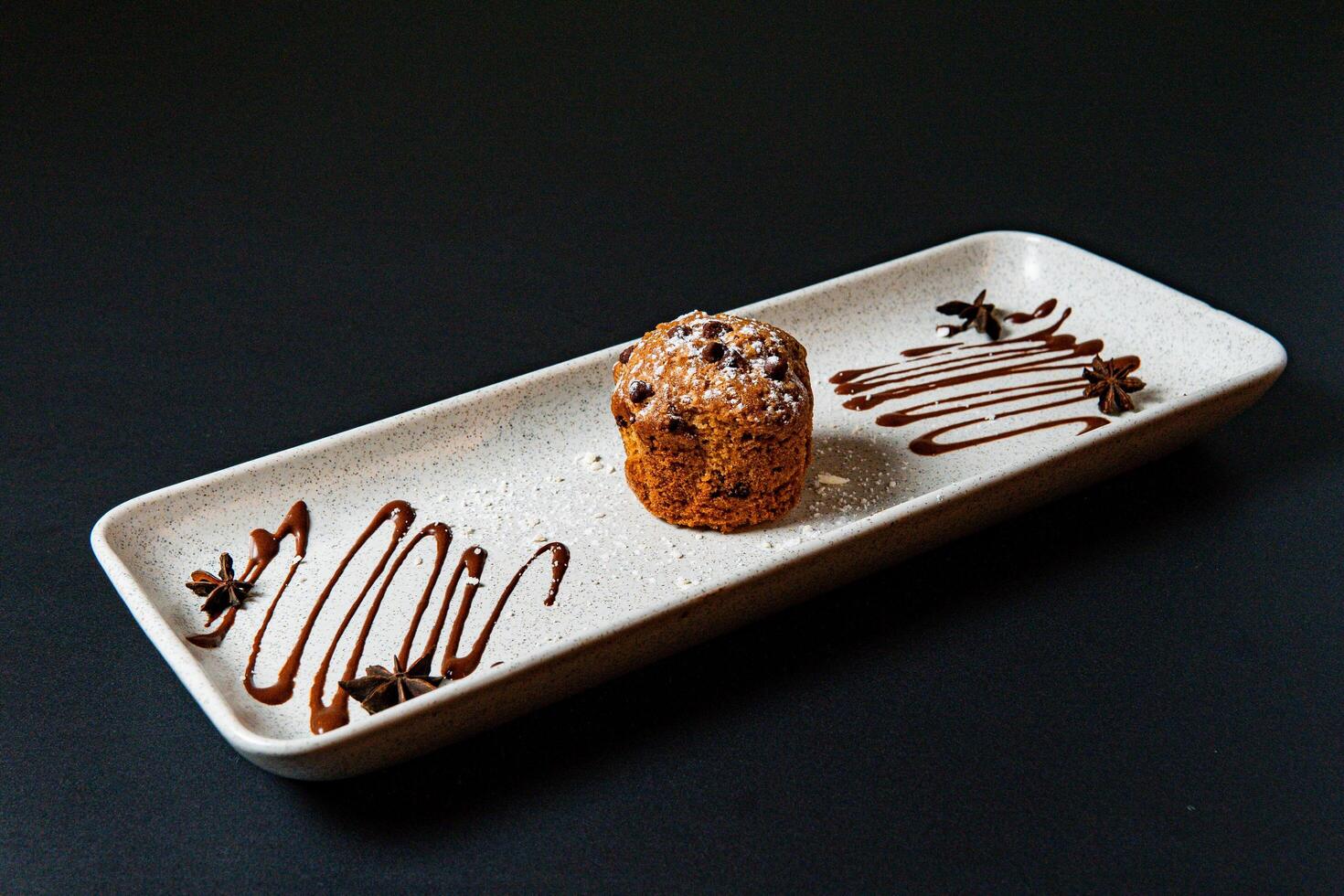 Muffin with powdered sugar. photo