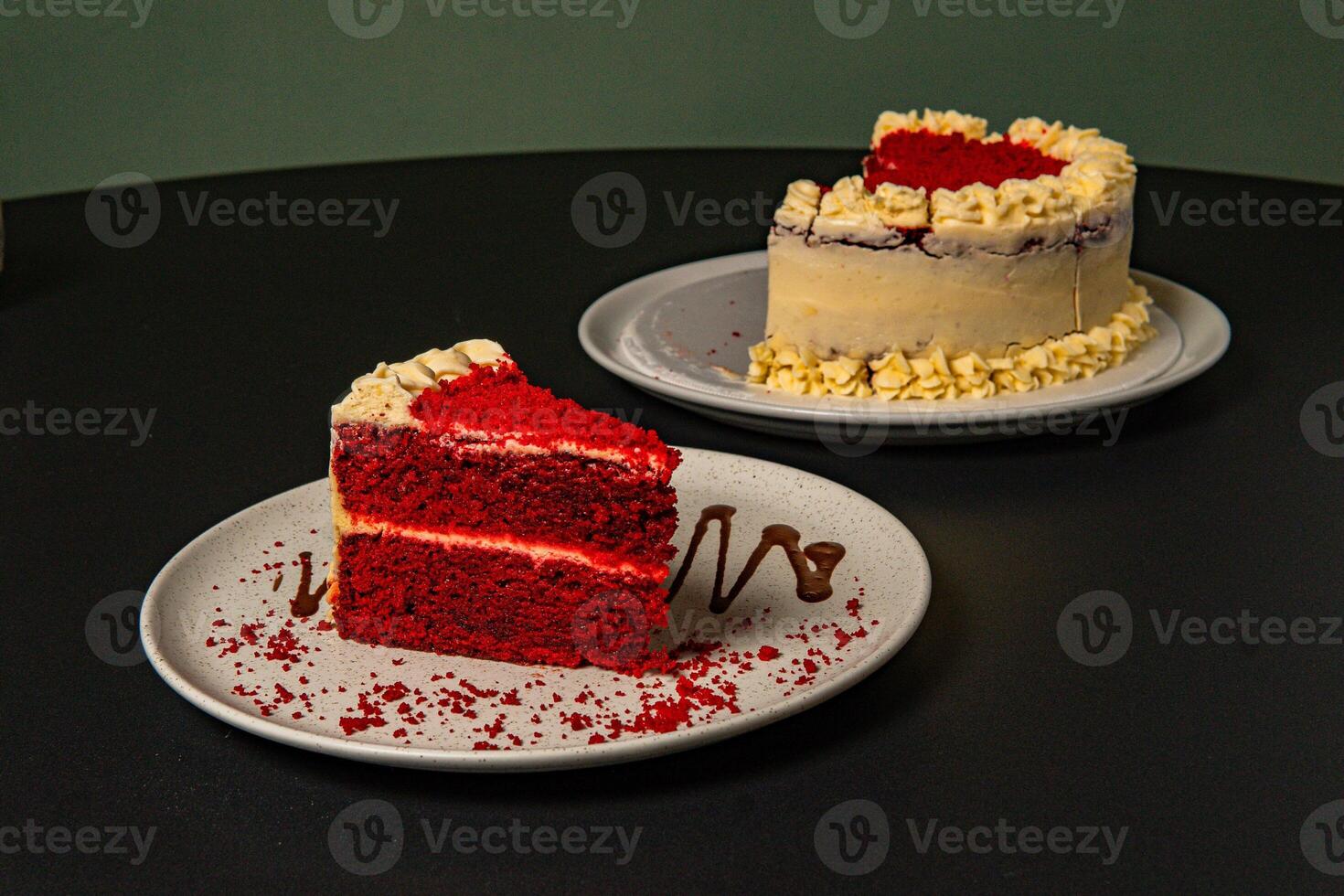 a plate with a piece of cake and chocolate drizzled on it. photo