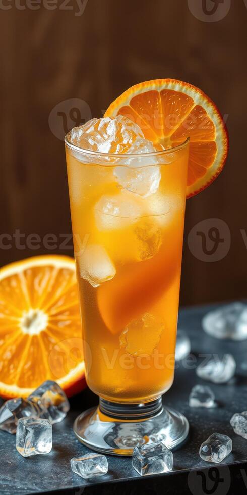 Refreshing citrus cocktail garnished with orange slices and ice cubes on a wooden background photo