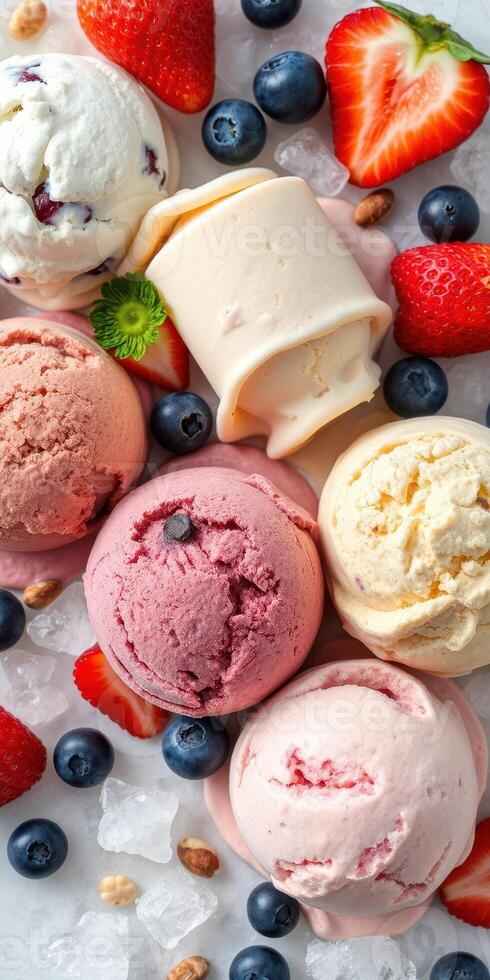 Ice cream assortment featuring various flavors and fresh fruits arranged on a cold surface photo