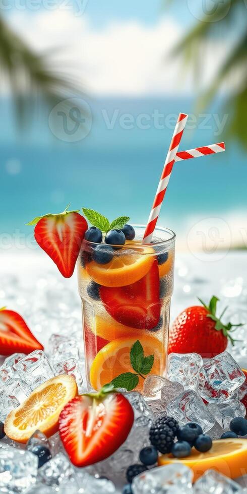 Refreshing fruit cocktail served over ice with ocean view during a sunny day photo