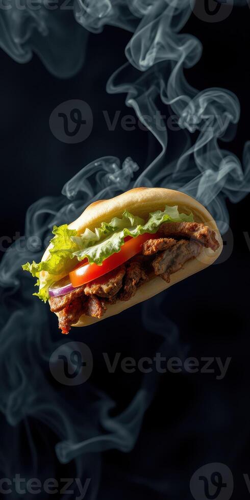 Delicious grilled sandwich with vegetables and smoke rising in a dark background photo