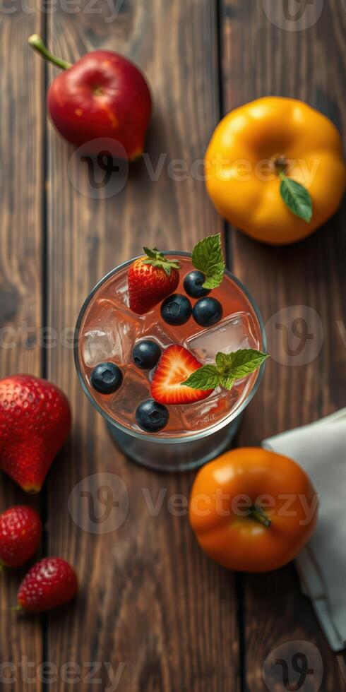 Refreshing fruit cocktail with strawberries, blueberries, and pears on rustic wooden table photo