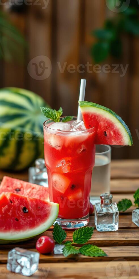 Refreshing watermelon cocktail served on a wooden table with sliced fruit and mint leaves photo