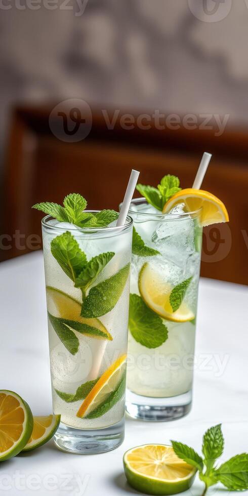 Refreshing mint lemonade served in tall glasses with lime and mint at a cozy cafe during summer afternoon photo