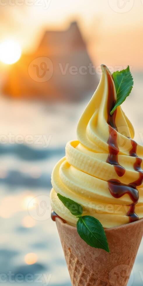 Delicious soft serve ice cream cone with chocolate syrup against a sunset beach background photo