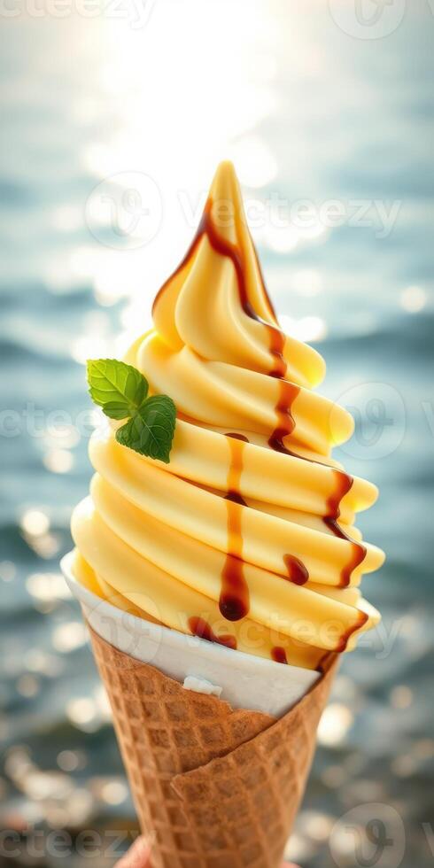 Delicious ice cream cone with caramel drizzle enjoyed by the sea photo