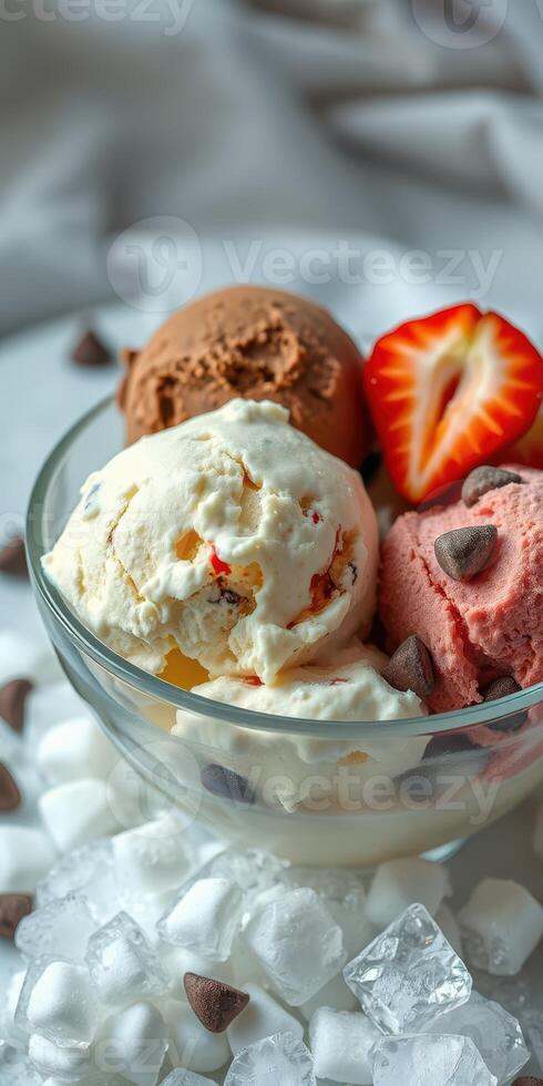Delicious ice cream sundae with chocolate chips and fresh strawberries displayed on a white background photo