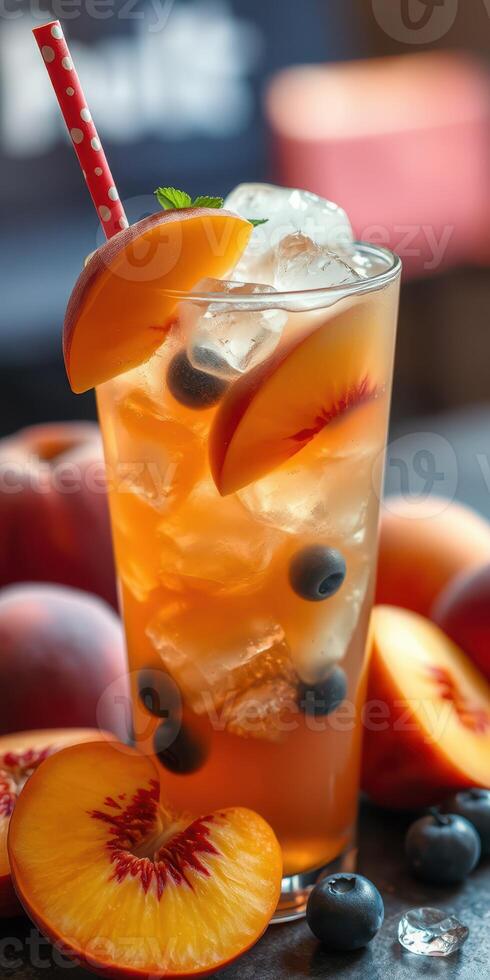 Refreshing summer drink featuring peaches and blueberries on a warm afternoon photo