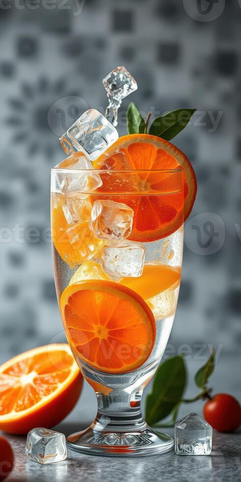 Refreshing citrus drink with ice and fresh oranges presented on a stylish table photo
