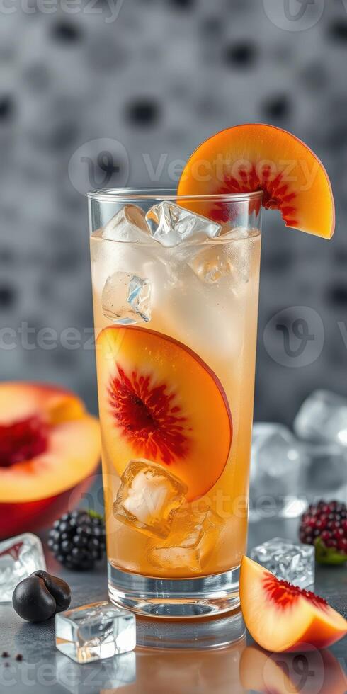 Refreshing peach drink with ice and berries in a stylish glass on a textured background photo