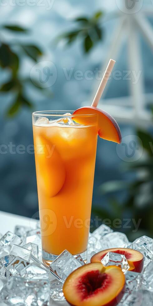 Refreshing peach iced drink garnished with fresh peach slices and served over ice cubes photo