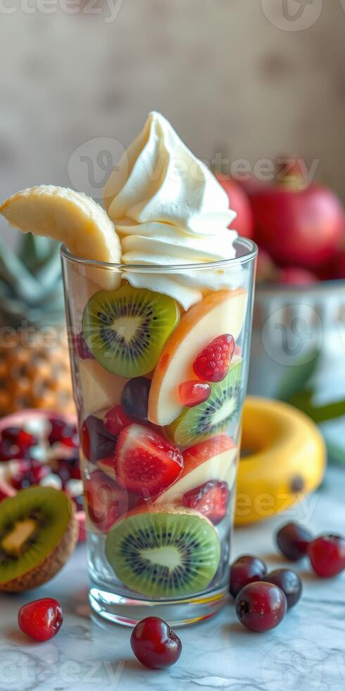 Delicious fruit parfait with vibrant layers of fresh strawberries, kiwis, and a swirl of creamy topping photo