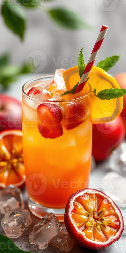 Refreshing fruit cocktail with vibrant colors and garnishes served in a clear glass on a summer day photo