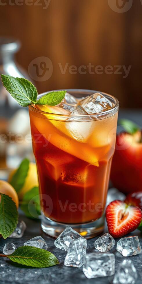 Refreshing iced tea with fresh fruits and mint served on a rustic table photo