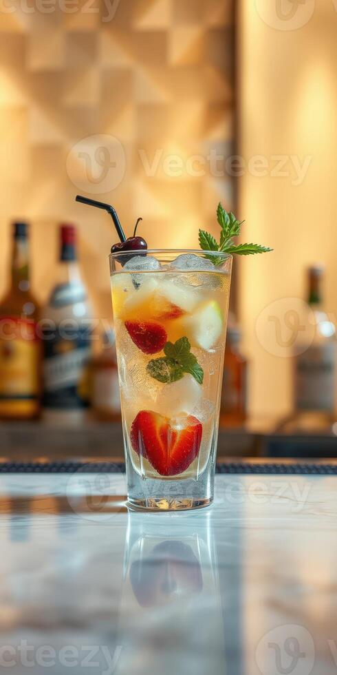 Refreshing summer cocktail with fresh fruit and mint served at a stylish bar in the late afternoon photo