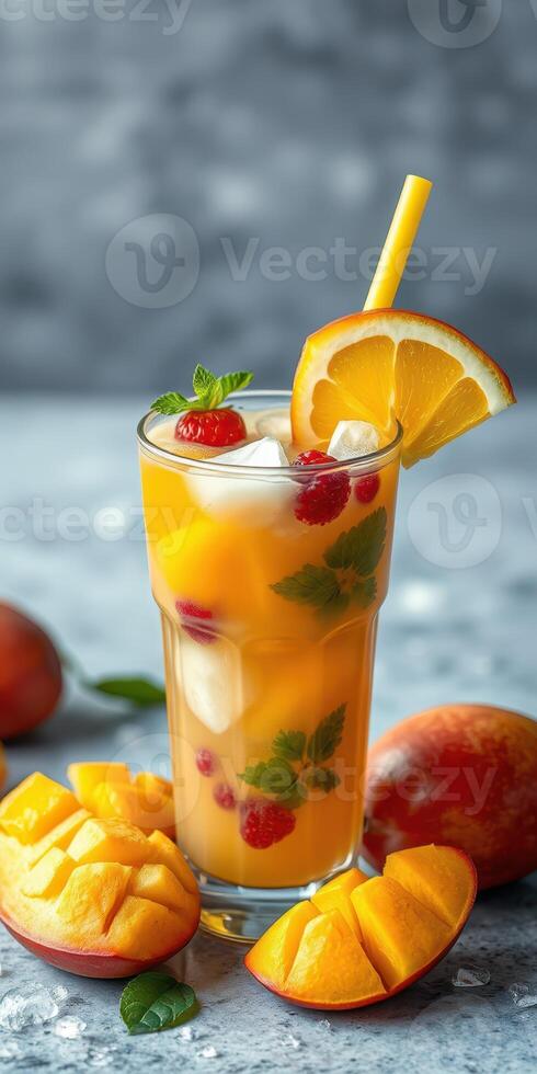 Refreshing tropical fruit drink with mango, orange, and raspberry in summer setting photo