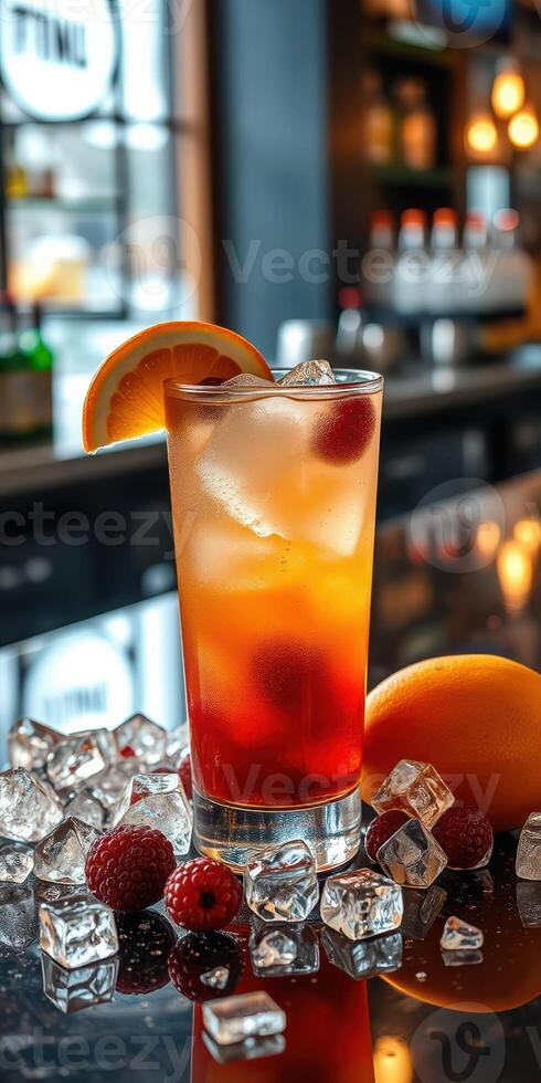 Refreshing cocktail served with garnishes and ice on a bar countertop during late evening hours photo