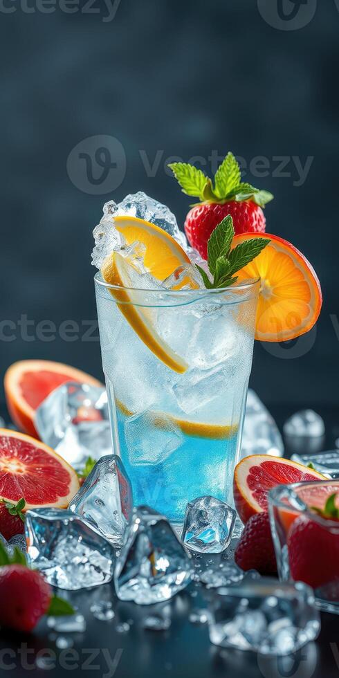 Refreshing blue drink garnished with citrus and berries served on ice with fresh fruit around photo