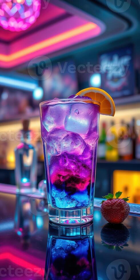 Colorful cocktail served in a tall glass at a vibrant bar with LED lighting photo