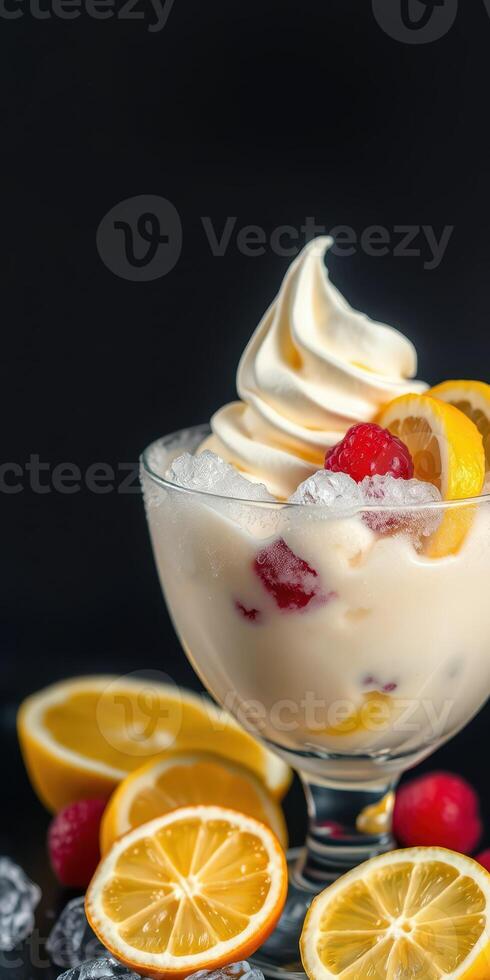 Delicious dessert featuring soft serve ice cream, fresh raspberries, and lemon slices served in a glass bowl photo